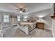 Main bedroom features neutral decor, a ceiling fan, and furnishings to match the decor at 939 Flowers Xing, Lawrenceville, GA 30044