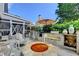 Beautiful outdoor kitchen features built-in grill, stone accents, seating and a fire pit for relaxing and entertaining guests at 939 Flowers Xing, Lawrenceville, GA 30044