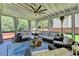 Charming screened porch with comfortable seating, ceiling fan, and outdoor ambiance at 939 Flowers Xing, Lawrenceville, GA 30044