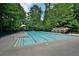 Large outdoor community swimming pool with lane markers and lounge area, perfect for relaxation and recreation at 939 Flowers Xing, Lawrenceville, GA 30044