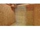 Storage room in basement with OSB walls, concrete floor, and exposed ceiling at 127 Grandmar Chase, Canton, GA 30115