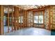 Unfinished basement with exposed insulation, wooden framing and a window at 127 Grandmar Chase, Canton, GA 30115