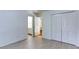 Bedroom featuring laminate floors, access to a bathroom, and a closet with bi-fold doors for ample storage at 127 Grandmar Chase, Canton, GA 30115