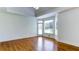 Bright bedroom with a trey ceiling, wood flooring, and access to outdoor patio at 127 Grandmar Chase, Canton, GA 30115