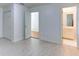 Bright bedroom showcasing white laminate flooring, closet space, and access to a bathroom with vanity at 127 Grandmar Chase, Canton, GA 30115