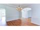 Bright dining room with hardwood floors, wainscoting and a chandelier at 127 Grandmar Chase, Canton, GA 30115
