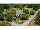 Beautiful home nestled on a lush golf course lot, showcasing mature trees and manicured landscaping at 127 Grandmar Chase, Canton, GA 30115