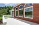 Brick house with large windows and a spacious deck overlooking a lush green lawn at 127 Grandmar Chase, Canton, GA 30115