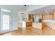 Spacious kitchen with hardwood floors, stainless steel appliances, and a large island at 127 Grandmar Chase, Canton, GA 30115