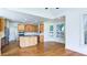 Well-lit kitchen featuring stainless steel appliances, a granite island, and a bay window at 127 Grandmar Chase, Canton, GA 30115