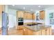 Updated kitchen featuring stainless steel appliances and a large granite island at 127 Grandmar Chase, Canton, GA 30115