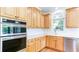Lovely kitchen featuring lots of cabinet space, stainless appliances, and a modern backsplash at 127 Grandmar Chase, Canton, GA 30115