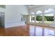 Bright, airy living room boasts hardwood floors and a wall of large windows with scenic views at 127 Grandmar Chase, Canton, GA 30115