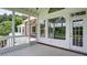 Relaxing screened porch featuring white railings and views of the backyard at 127 Grandmar Chase, Canton, GA 30115