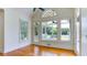 Bright sunroom with hardwood floors, large windows, and access to a screened-in porch at 127 Grandmar Chase, Canton, GA 30115
