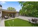 A furnished outdoor deck with a mini golf putting green and a lounge area at 1287 Star Ne Dr, Brookhaven, GA 30319