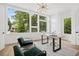 Well-lit home office with large windows, modern decor, and hardwood floors at 1287 Star Ne Dr, Brookhaven, GA 30319