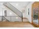 Staircase featuring modern black railing and hardwood steps leading to the upper level at 1287 Star Ne Dr, Brookhaven, GA 30319