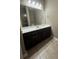 Spacious bathroom boasts a large mirror and a long countertop with ample storage space at 1955 Nocturne Dr # 3105, Alpharetta, GA 30009