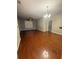 Spacious living room featuring hardwood floors, a ceiling fan and lots of natural light at 1955 Nocturne Dr # 3105, Alpharetta, GA 30009