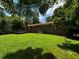 A backyard with a brick house, green grass, trees and a patio at 199 Mckaskey Creek Se Rd, Cartersville, GA 30121