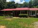 Close up showing the front of the home with an attractive brick facade and well-maintained landscaping at 199 Mckaskey Creek Se Rd, Cartersville, GA 30121