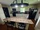 Eat-in kitchen with granite counters and white cabinets at 199 Mckaskey Creek Se Rd, Cartersville, GA 30121