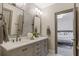 Charming bathroom featuring double vanity and views into the bedroom at 49 Conifer Park Ln, Atlanta, GA 30342