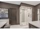 Bathroom featuring a glass-enclosed shower with detailed tile and updated fixtures at 49 Conifer Park Ln, Atlanta, GA 30342