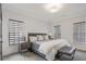 Bright bedroom featuring plush carpet, a stylish bed, and a bench at 49 Conifer Park Ln, Atlanta, GA 30342