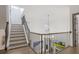 Spacious foyer showcasing staircase with iron railings and hardwood floors at 49 Conifer Park Ln, Atlanta, GA 30342