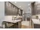 Modern gray kitchen featuring quartz countertops, stainless steel appliances, and custom cabinetry at 49 Conifer Park Ln, Atlanta, GA 30342