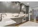 Stylish kitchen with shaker cabinets, modern hardware, and stainless-steel range and hood at 49 Conifer Park Ln, Atlanta, GA 30342