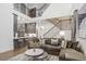 Open-concept living room featuring high ceilings, hardwood floors, and modern decor at 49 Conifer Park Ln, Atlanta, GA 30342