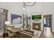 Elegant living room with a fireplace, tall windows, and modern decor at 49 Conifer Park Ln, Atlanta, GA 30342