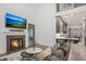 Cozy living room with a fireplace, large TV, and comfortable seating at 49 Conifer Park Ln, Atlanta, GA 30342