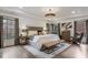 Spacious main bedroom with tray ceilings, large windows, and neutral tones at 49 Conifer Park Ln, Atlanta, GA 30342