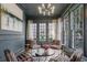 Chic sitting room with an elegant chandelier and abundant natural light at 49 Conifer Park Ln, Atlanta, GA 30342