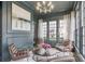 Stylish sitting room with dark walls, large windows, and comfortable seating at 49 Conifer Park Ln, Atlanta, GA 30342