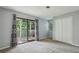 Bedroom with sliding glass doors to an outdoor balcony and large closet at 511 Barrington Hills Dr, Atlanta, GA 30350