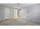 Bedroom with three closets and doorway to bathroom at 511 Barrington Hills Dr, Atlanta, GA 30350