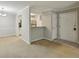 Open living space with a view of the kitchen, dining area, and entryway offering lots of natural light at 511 Barrington Hills Dr, Atlanta, GA 30350