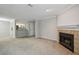 Spacious living area with a fireplace, open to the kitchen, and featuring a neutral color palette at 511 Barrington Hills Dr, Atlanta, GA 30350