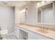 Bathroom featuring a double vanity, granite countertop and two mirrors at 1105 Clairemont Ave # J, Decatur, GA 30030