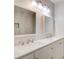 Bright bathroom with double sinks, modern fixtures, and a large, decorative mirror at 1105 Clairemont Ave # J, Decatur, GA 30030