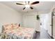 Comfortable bedroom with a ceiling fan, closet space, and neutral wall colors at 1105 Clairemont Ave # J, Decatur, GA 30030