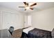 Bedroom featuring dark hardwood floors, ceiling fan, and closet at 1105 Clairemont Ave # J, Decatur, GA 30030