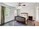 Bedroom featuring dark wood floors, ceiling fan and patterned curtains at 1105 Clairemont Ave # J, Decatur, GA 30030