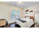 Bedroom with a window, dark wood floors, and decor guitars at 1105 Clairemont Ave # J, Decatur, GA 30030