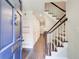 Inviting foyer with hardwood floors, staircase and view of the hallway at 1105 Clairemont Ave # J, Decatur, GA 30030